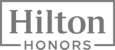 This image shows the Hilton Honors logo, featuring the word "Hilton" above "HONORS" in a rectangular frame.